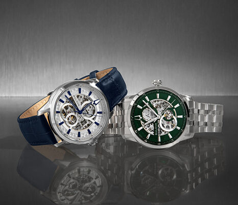 Bulova automatic skeleton watches with open-heart dials – one on blue leather strap and one with green dial on steel bracelet.